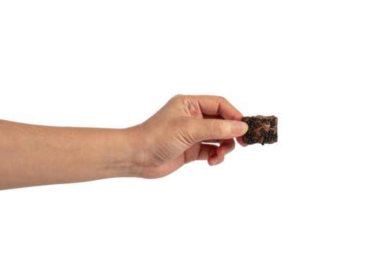 Nougat is a chocolate snack in hand on a transparent background.