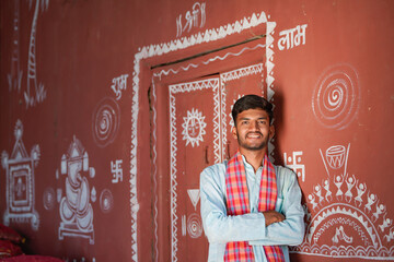 young indian asian farmer standing confidently at home