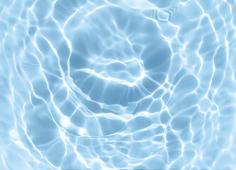 Abstract blurred shades of blue water background. Light and shadow ripples or splashes surface of water texture. Water waves with shining and reflection pattern photography for​ design artwork.