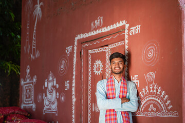 young indian asian farmer standing confidently at home