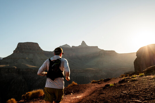 White male in his early 50s runs the Grand Canyon.