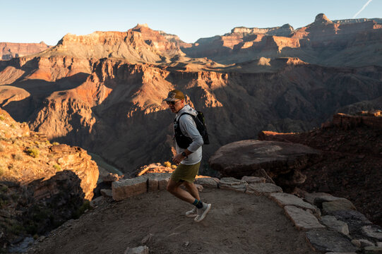 White male in his early 50s runs the Grand Canyon.