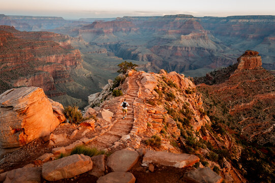 White male in his early 50s runs the Grand Canyon.