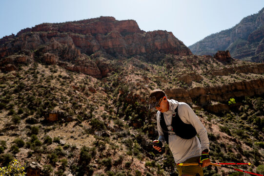 White male in his early 50s runs the Grand Canyon.