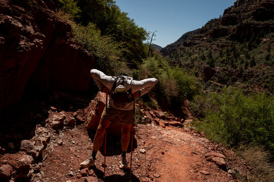White male in his early 50s runs the Grand Canyon.