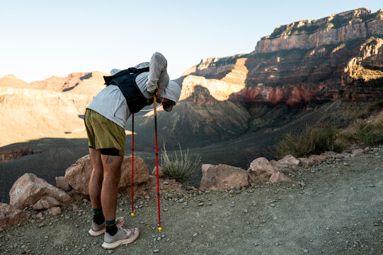 White male in his early 50s runs the Grand Canyon.