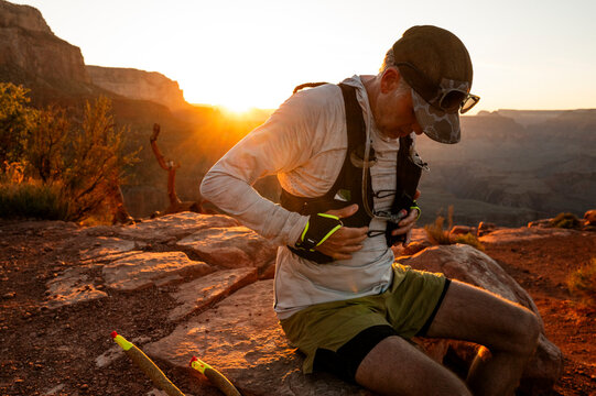 White male in his early 50s runs the Grand Canyon.