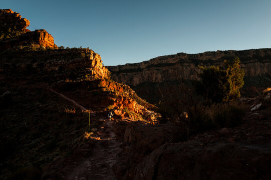 White male in his early 50s runs the Grand Canyon.