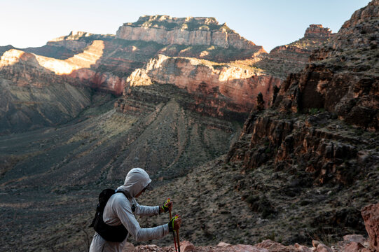 White male in his early 50s runs the Grand Canyon.