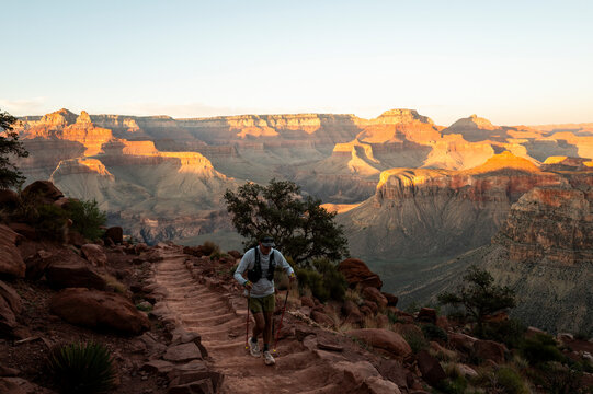 White male in his early 50s runs the Grand Canyon.