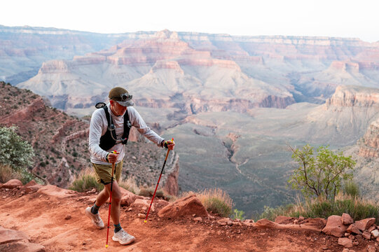 White male in his early 50s runs the Grand Canyon.