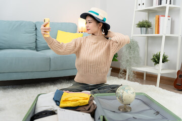 Traveler, travel bag. Portrait asian beautiful girl selfie and feel relax during bag pack. Pack...