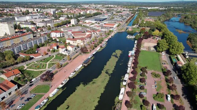 aerial shot revealing Roanne city Harbor and the Roanne Digoin canal on a sunny day in Loire departement, Auvergne Rhone Alpes region, France