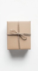 A square, light beige gift box, tied with light brown twine