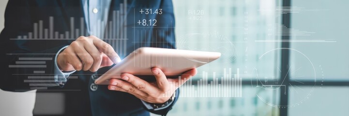 Close-up of a person using a tablet with data visualizations.