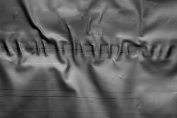 black crumpled and creased plastic bag texture background