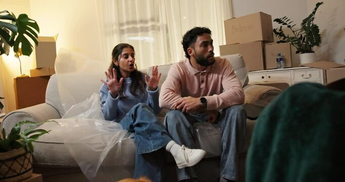 Frustrated couple, fight and debt with boxes for eviction notice, move or home migration. Conflict, man and woman with disagreement or argument for bankruptcy, mortgage crisis or house repossession