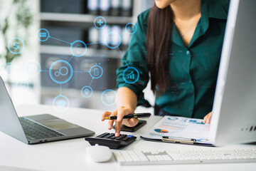 Businesswoman doing finances and calculate to analysis graph company financial about cost at office.