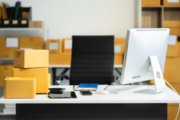 Workspace with desktop computer, office supplies, houseplant and box at office. desk work concept.