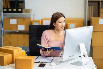 entrepreneur or freelance checking orders from customers, woman runs an e-commerce business on...