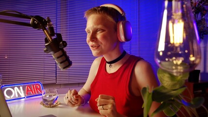 Person Engaged in Podcast Recording at a Modern Studio