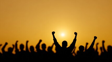 Silhouetted crowd is raising fists in protest at sunset, expressing their dissent and fighting for their rights in the fight against immigration raids