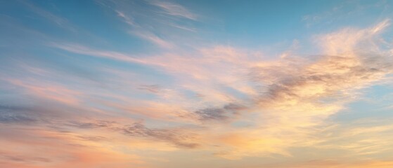 Obraz premium The breathtaking sky adorned with soft pastel clouds at sunset