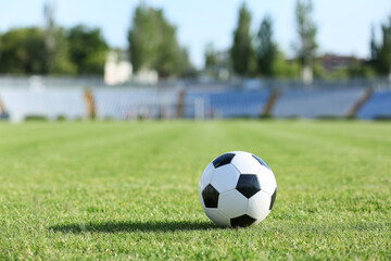 Soccer ball on green stadium grass