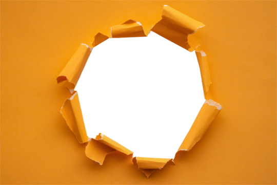 Torn ripped orange paper hole isolated on white background