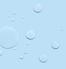 round drops of transparent gel serum on blue background