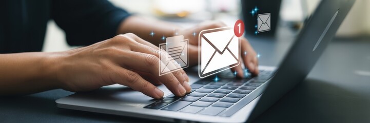 Person using laptop to send emails.