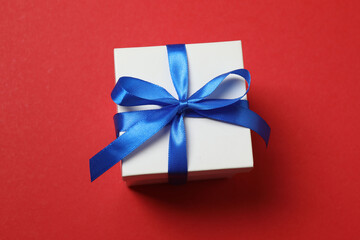 gift box with bow on red background