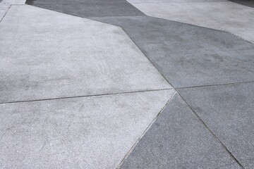 Light and dark exposed aggregate concrete floor texture background	