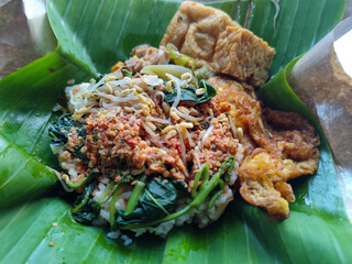Nasi pecel or sego pecel is a typical Javanese Indonesian rice dish served with pecel sauce, which...