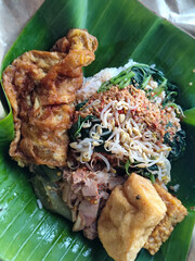Nasi pecel or sego pecel is a typical Javanese Indonesian rice dish served with pecel sauce, which...