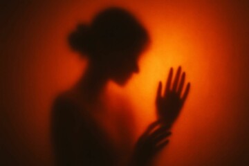 Dreamy Silhouette of a Woman Behind Frosted Glass with Warm Sunset Glow