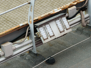 LED floodlights for night illumination of building walls and lightning rod conductor