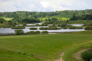 picturesque Russian summer expanses: fields, lakes, forest in Pushkin's Mikhailovskoye estate