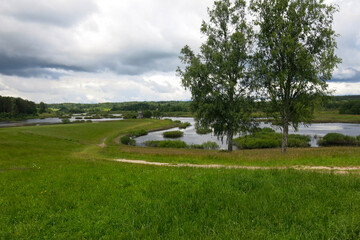 picturesque Russian summer expanses: fields, lakes, forest in Pushkin's Mikhailovskoye estate