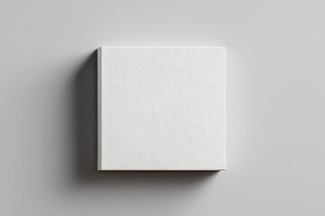 A square, off-white, textured box sits on a light grey background, subtly shadowed