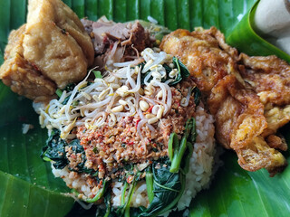 Nasi pecel or sego pecel is a typical Javanese Indonesian rice dish served with pecel sauce, which...