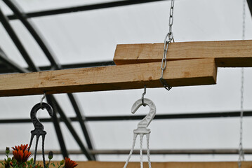 Construction for hanging flower pots.