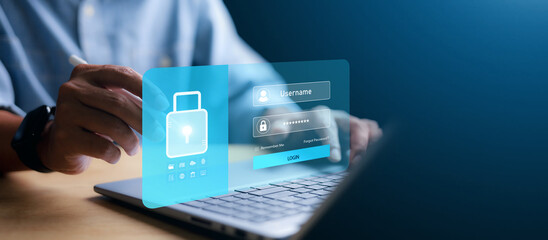 Businessman typing on laptop with virtual login interface overlay showing username password and...