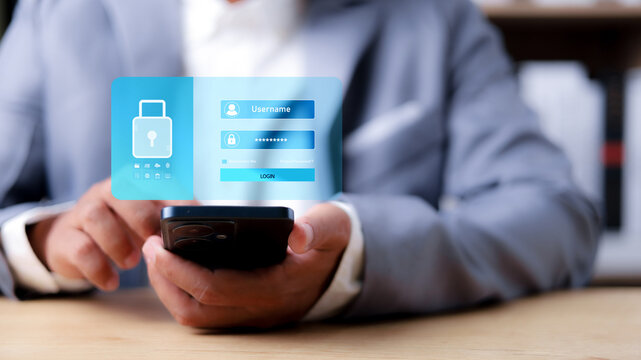 Close-up of a man using smartphone with virtual password input and login button. Concept of secure mobile authentication, user access control, and cybersecurity protection.