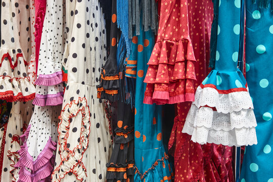 Traditional multicolored Flamenco costume. Elegant woman andalusian dresses. Sevillanas. Spain