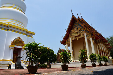 Ancient white stupa or chedi and antique building ubosot for thai people traveler travel visit...