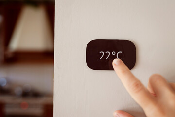 control panel climate control sensor touch on the wall inside the house in the kitchen