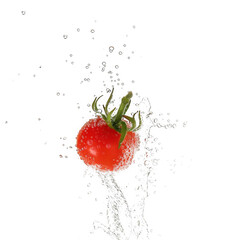 Red cherry tomato splashing in water isolated on transparent background