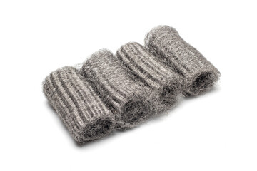 Steel wool, also known as iron wool or wire sponge. commonly used as an abrasive for cleaning, polishing, and surface preparation. isolated in white background.
