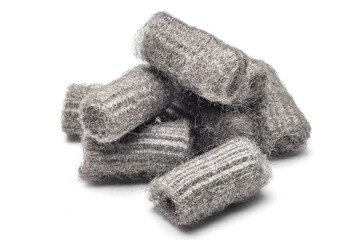 Steel wool, also known as iron wool or wire sponge. commonly used as an abrasive for cleaning, polishing, and surface preparation. isolated in white background.